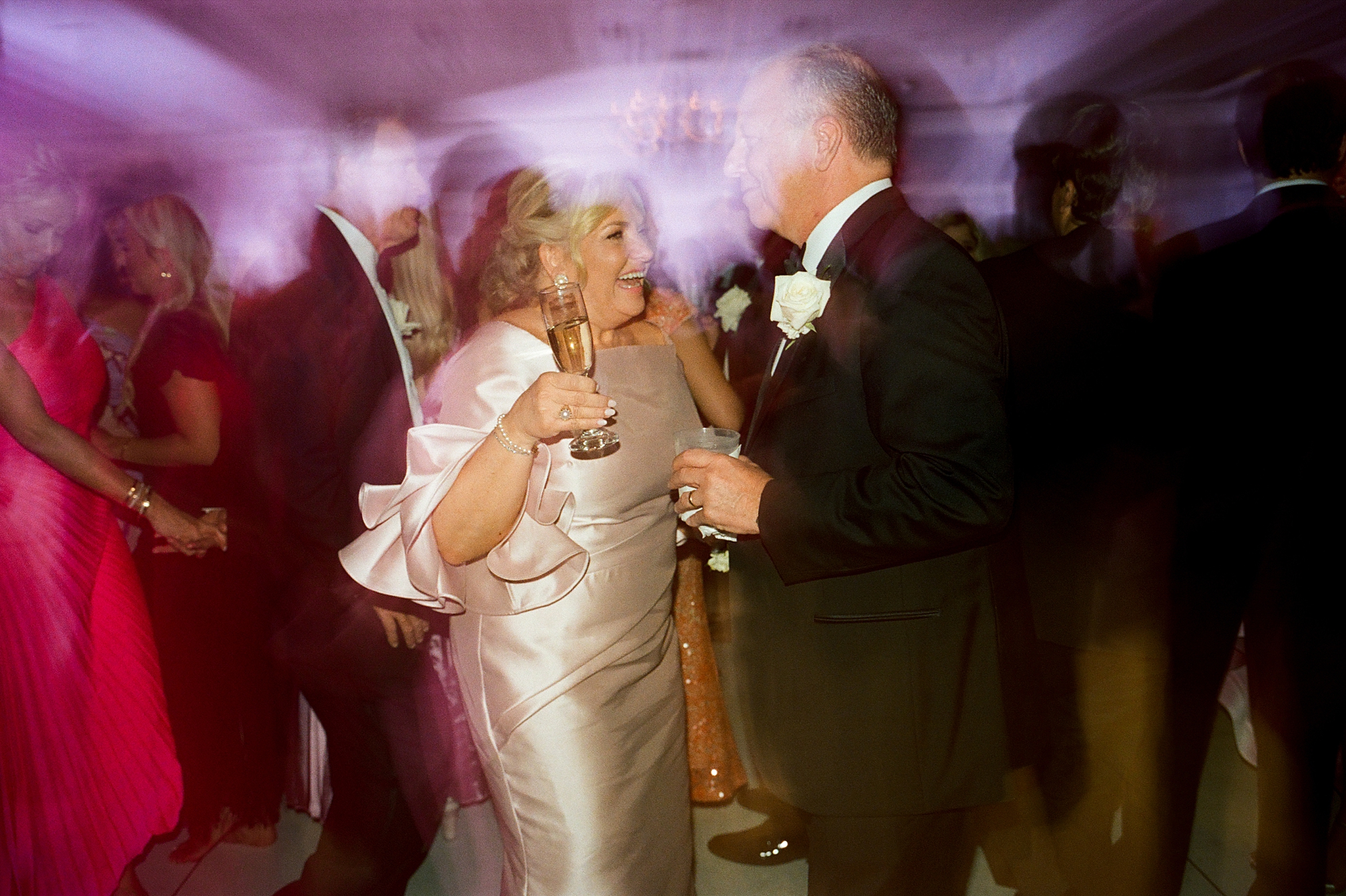 parents of newlyweds dance during wedding reception at the City Club at River Ranch