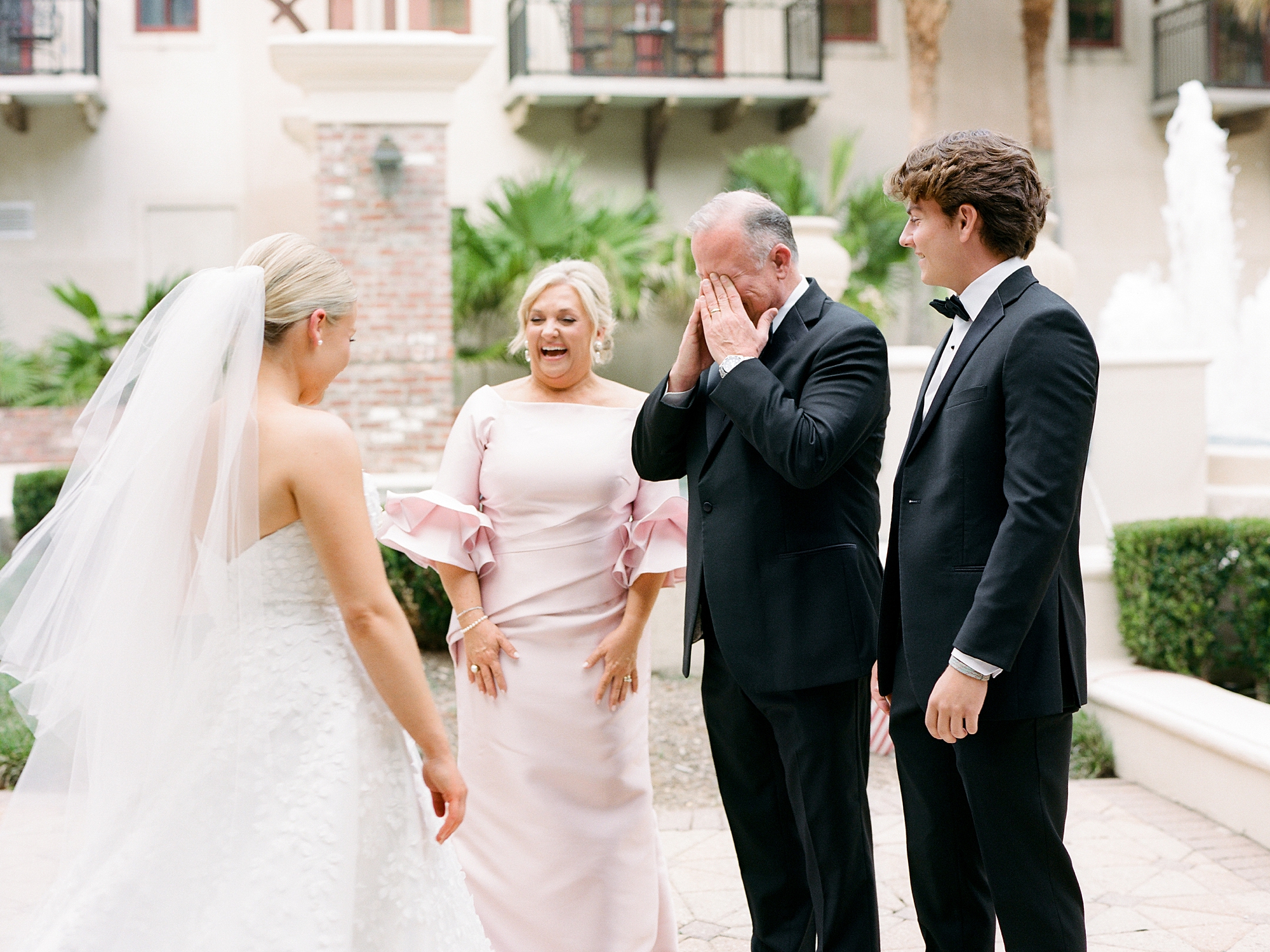 bride's father cries when he shows her wedding dress 