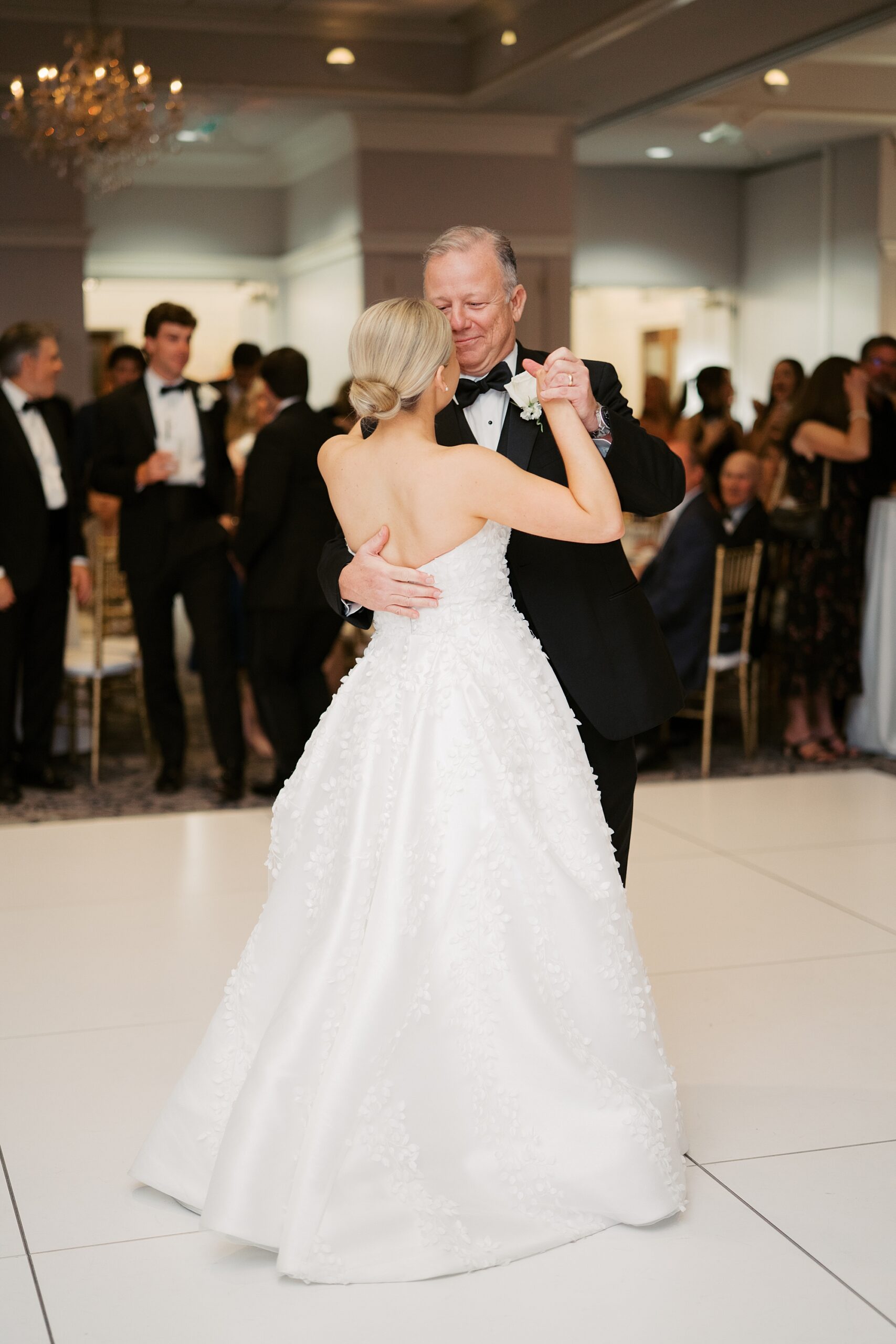 bride and father dance together during wedding reception in Lafayette LA