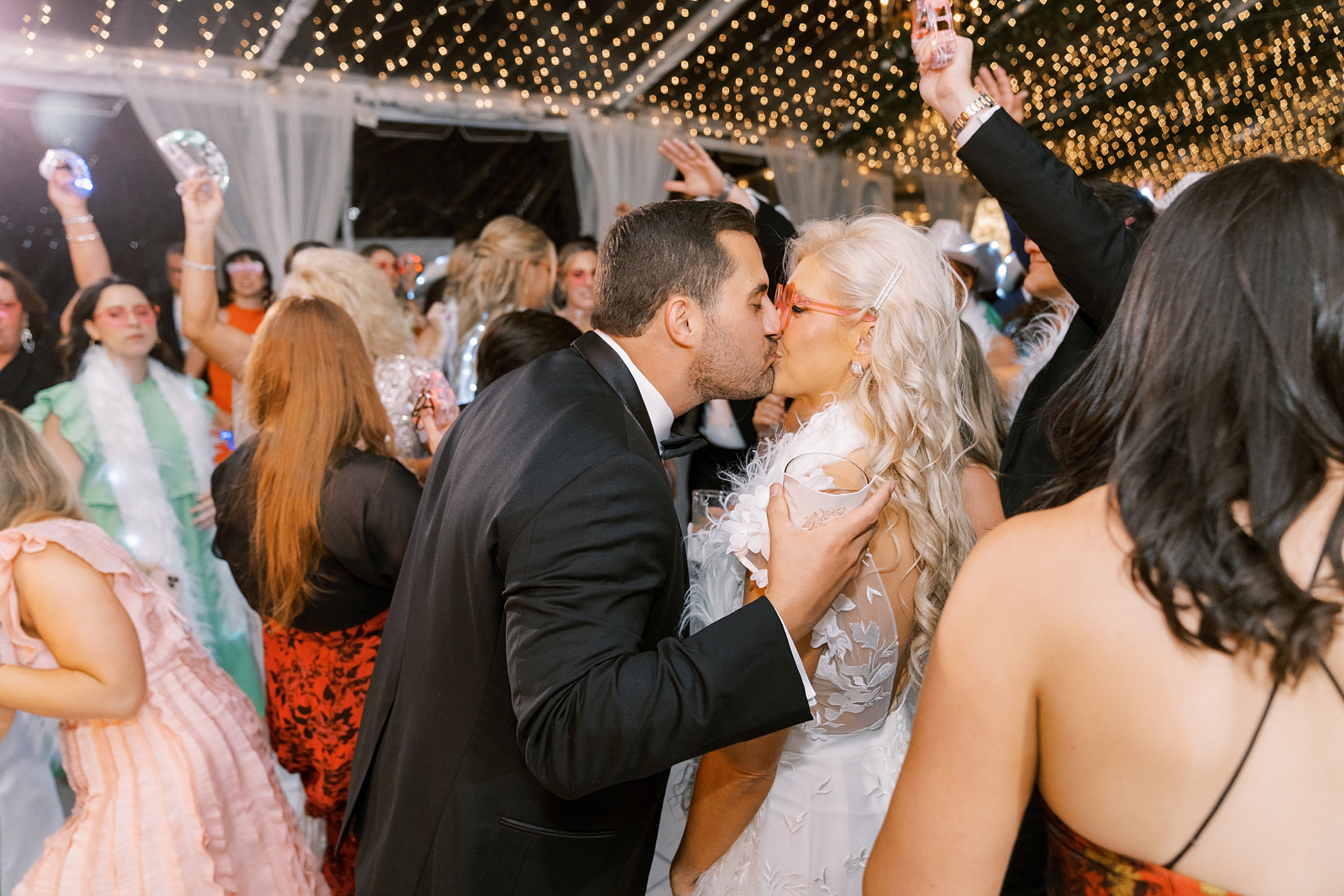 bride and groom kiss on dance floor at the University of Louisiana at Lafayette alumni center