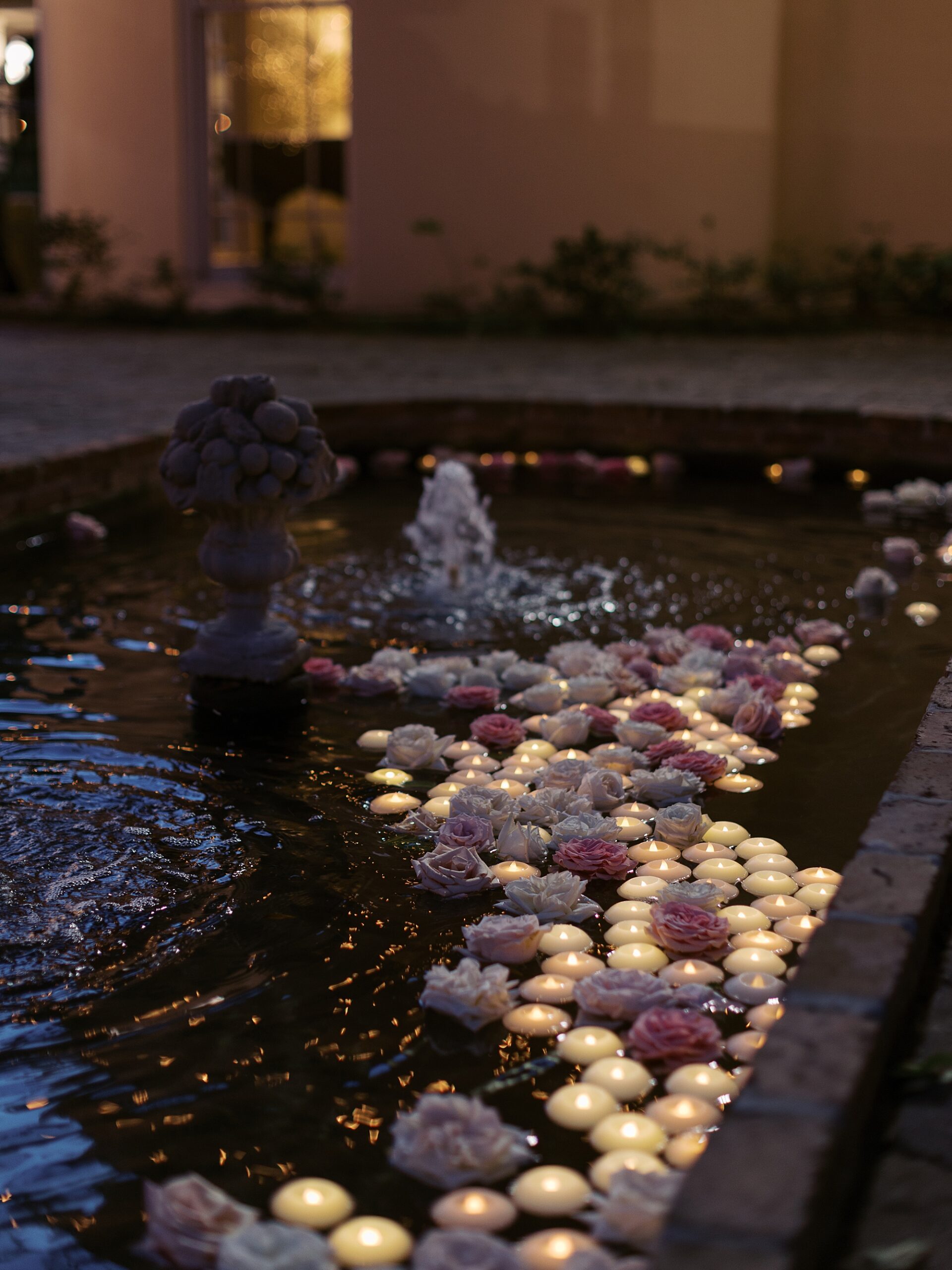 flowers float in pond at the University of Louisiana at Lafayette alumni center