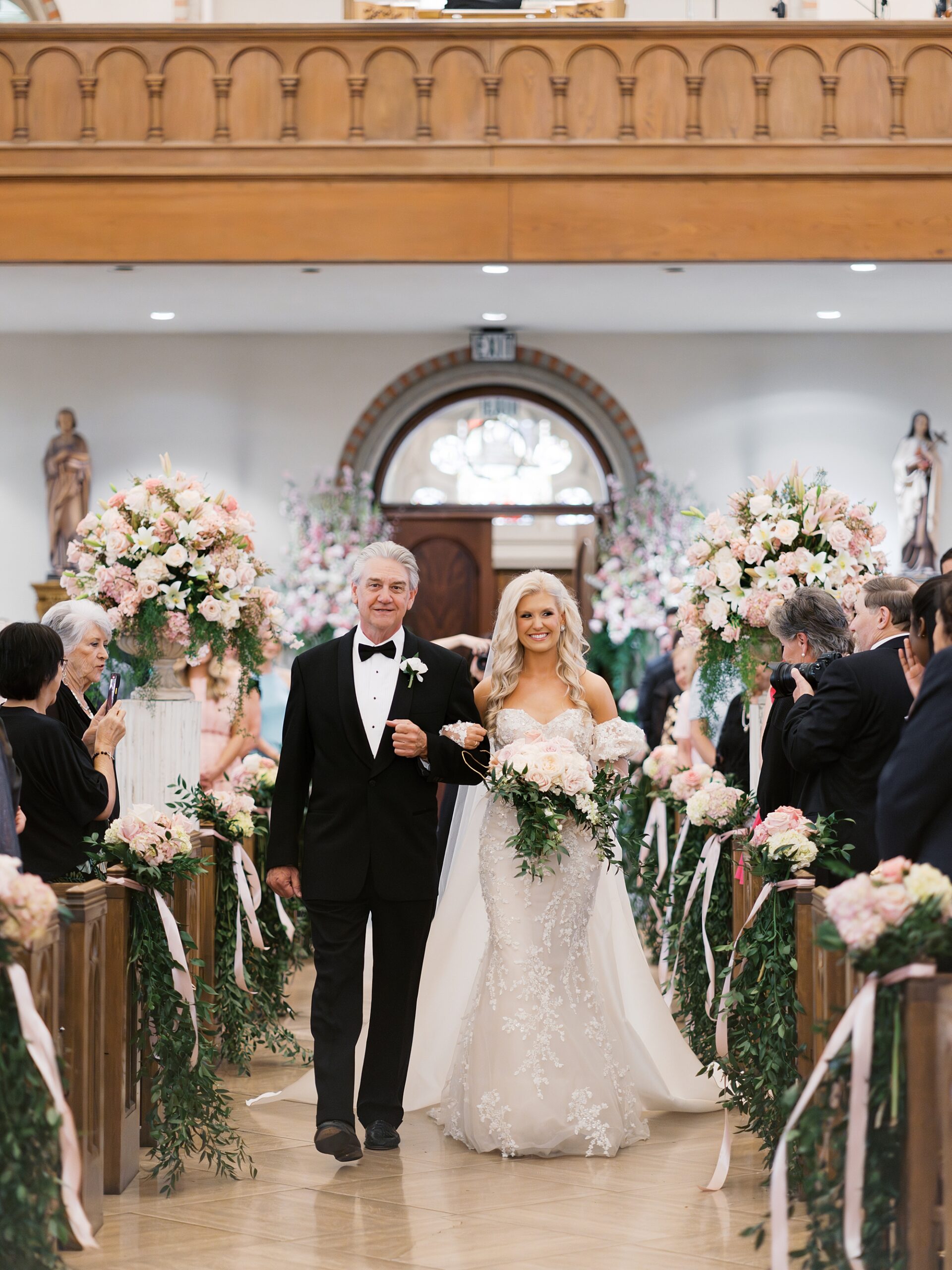 father walks down aisle with bride at Cathedral Of St. John