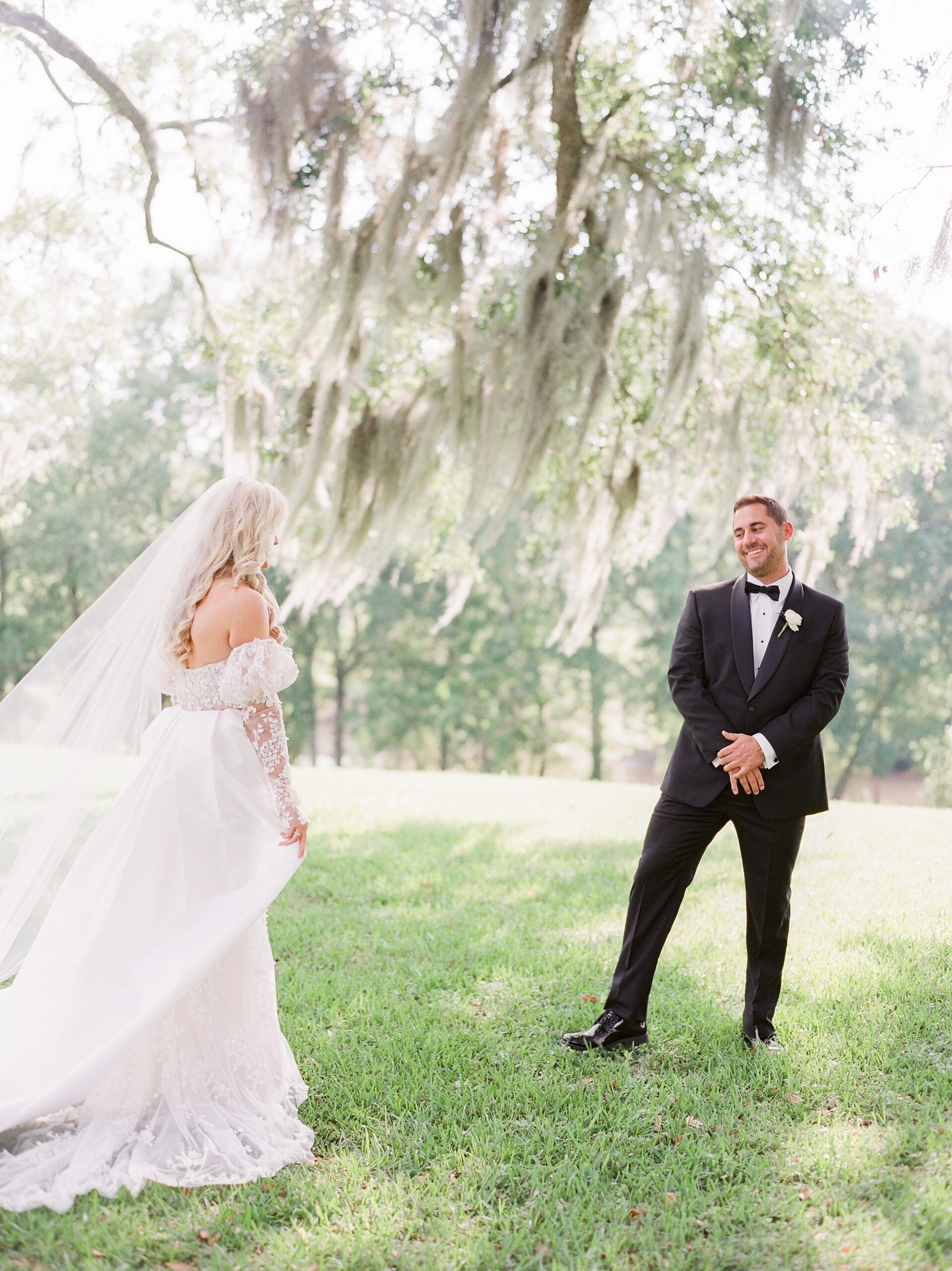groom turns to look at bride during first look in Lafayette LA