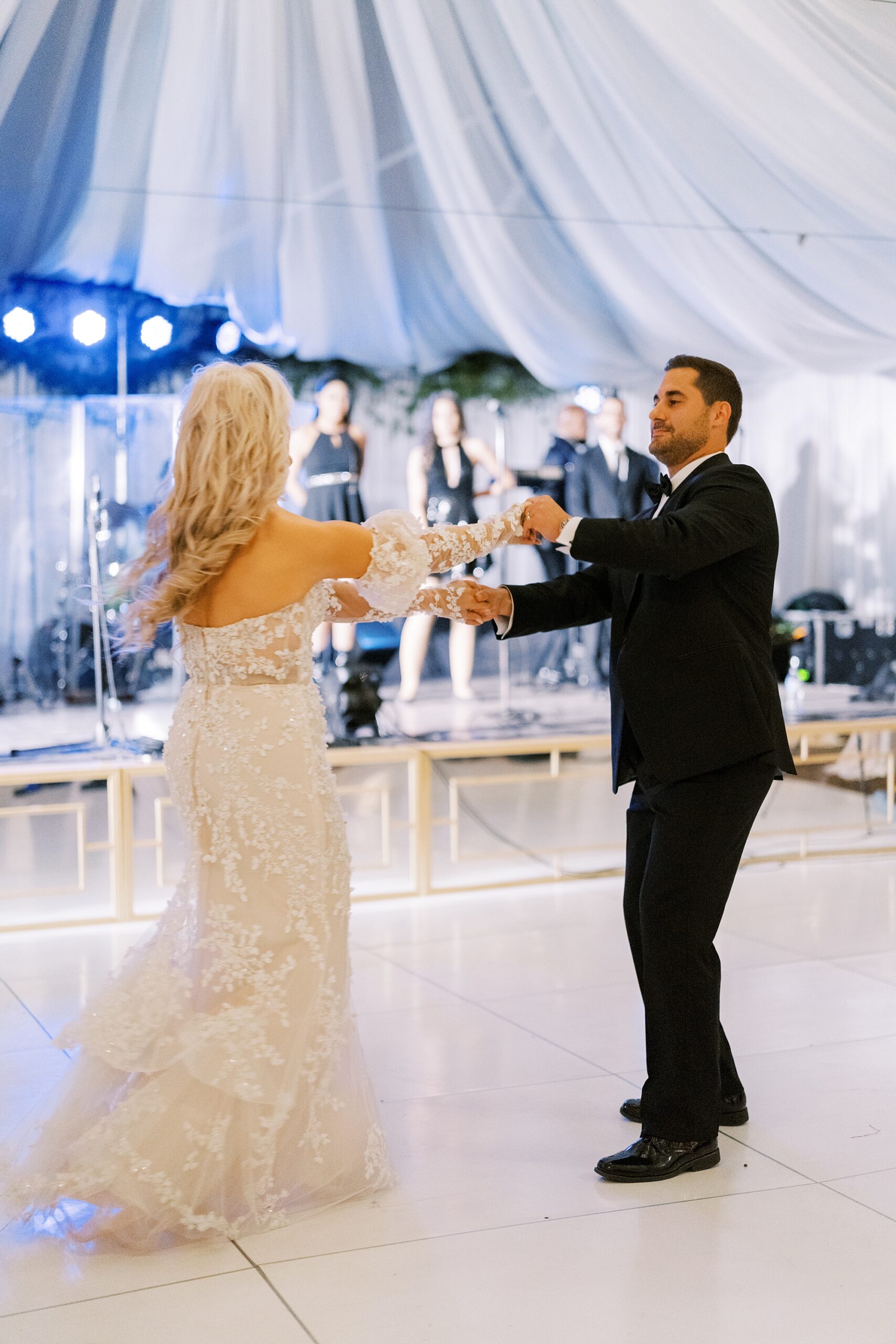 newlyweds dance together during wedding reception at the University of Louisiana at Lafayette alumni center