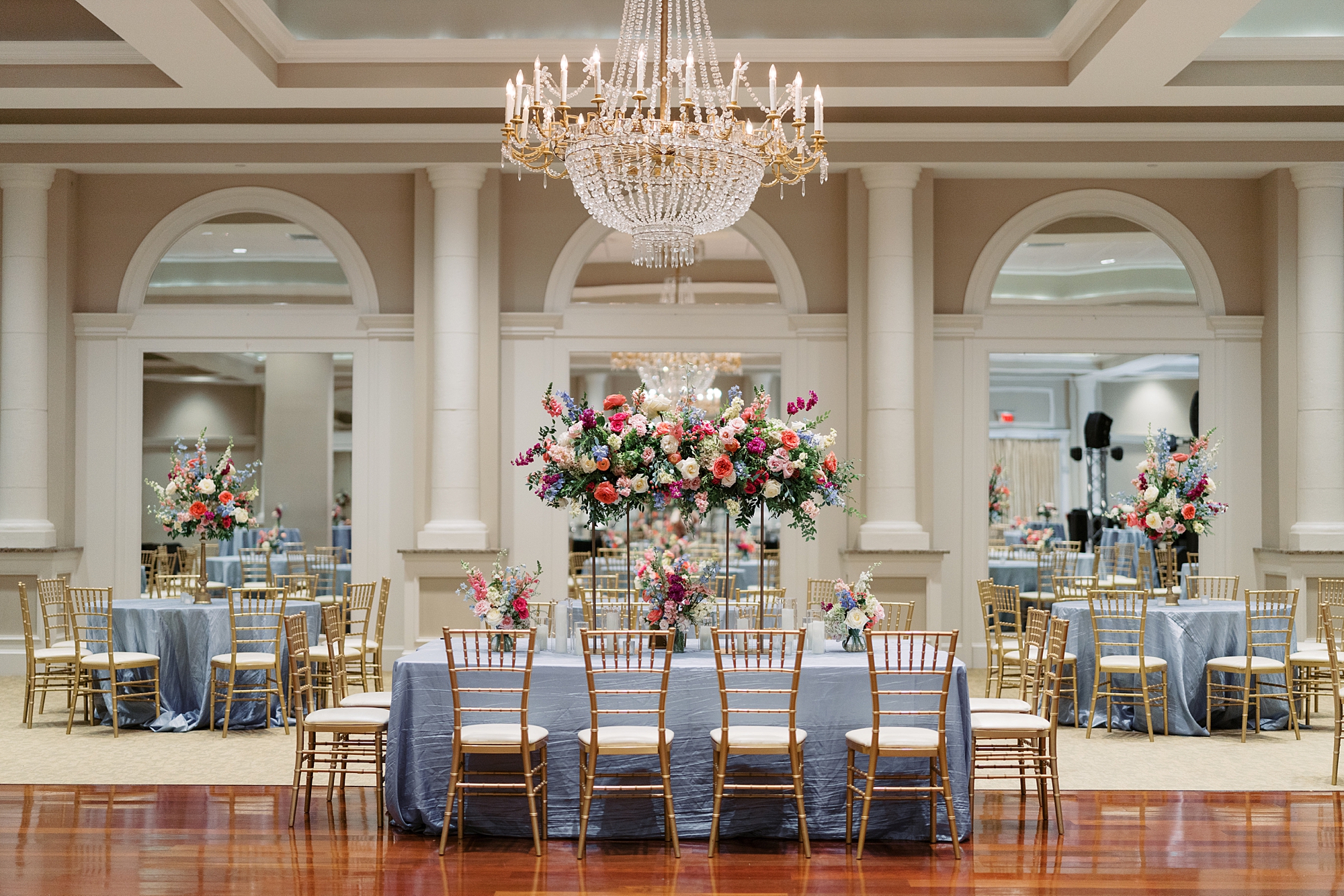 classic wedding reception with pink and blue details at Le Pavilion Hotel