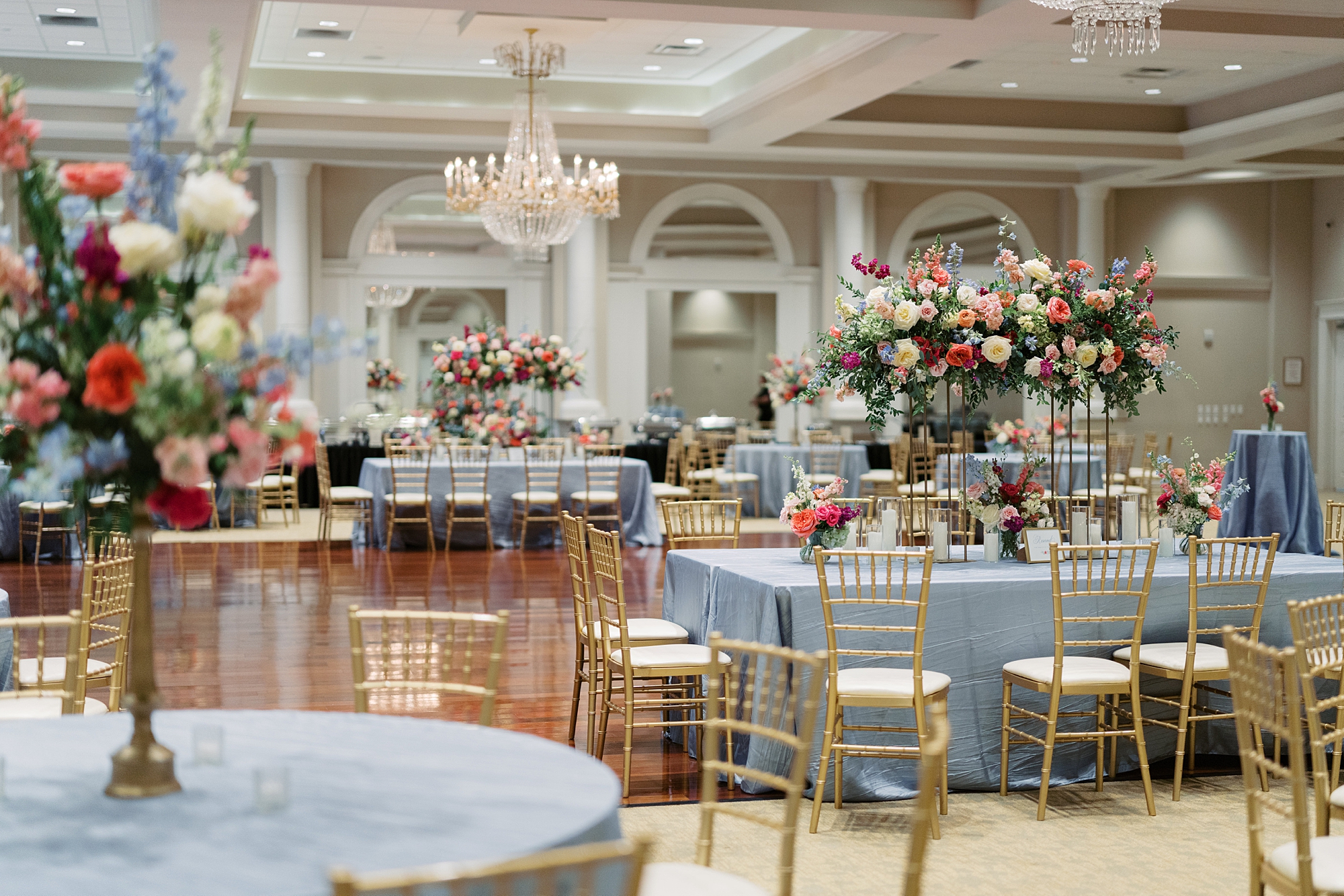 wedding reception at Le Pavilion Hotel with pink, white and blue floral displays 