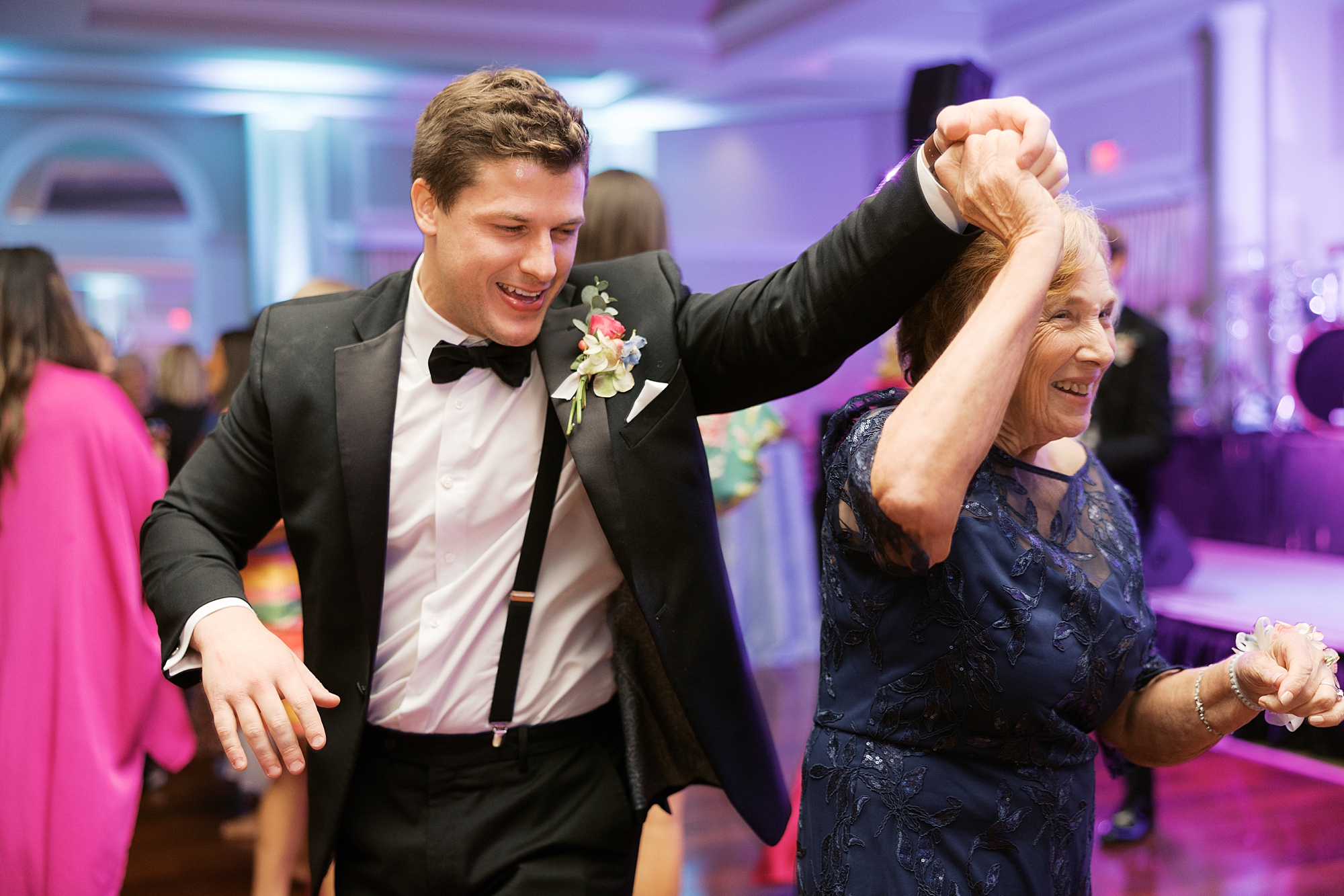 groom dances with wedding guests during NOLA wedding reception 