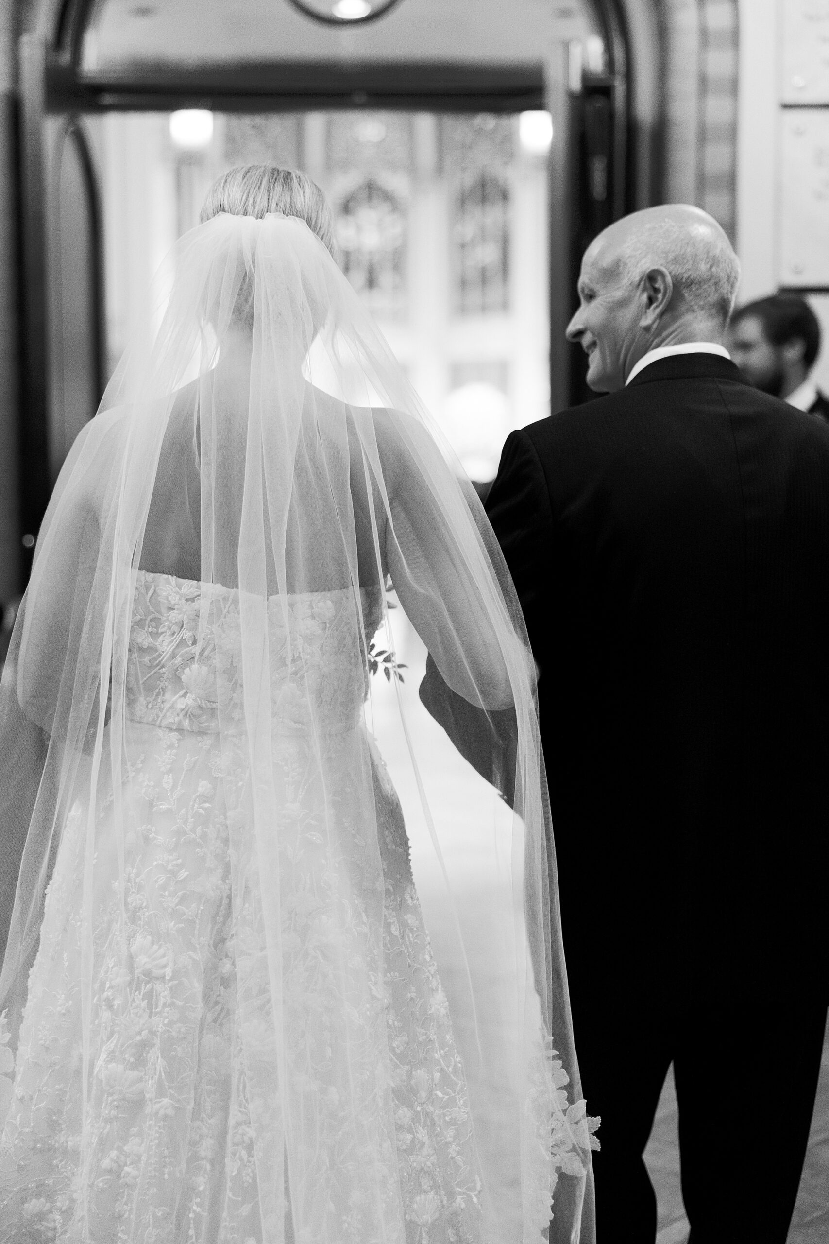father walks bride down aisle inside St. John’s Cathedral in New Orleans