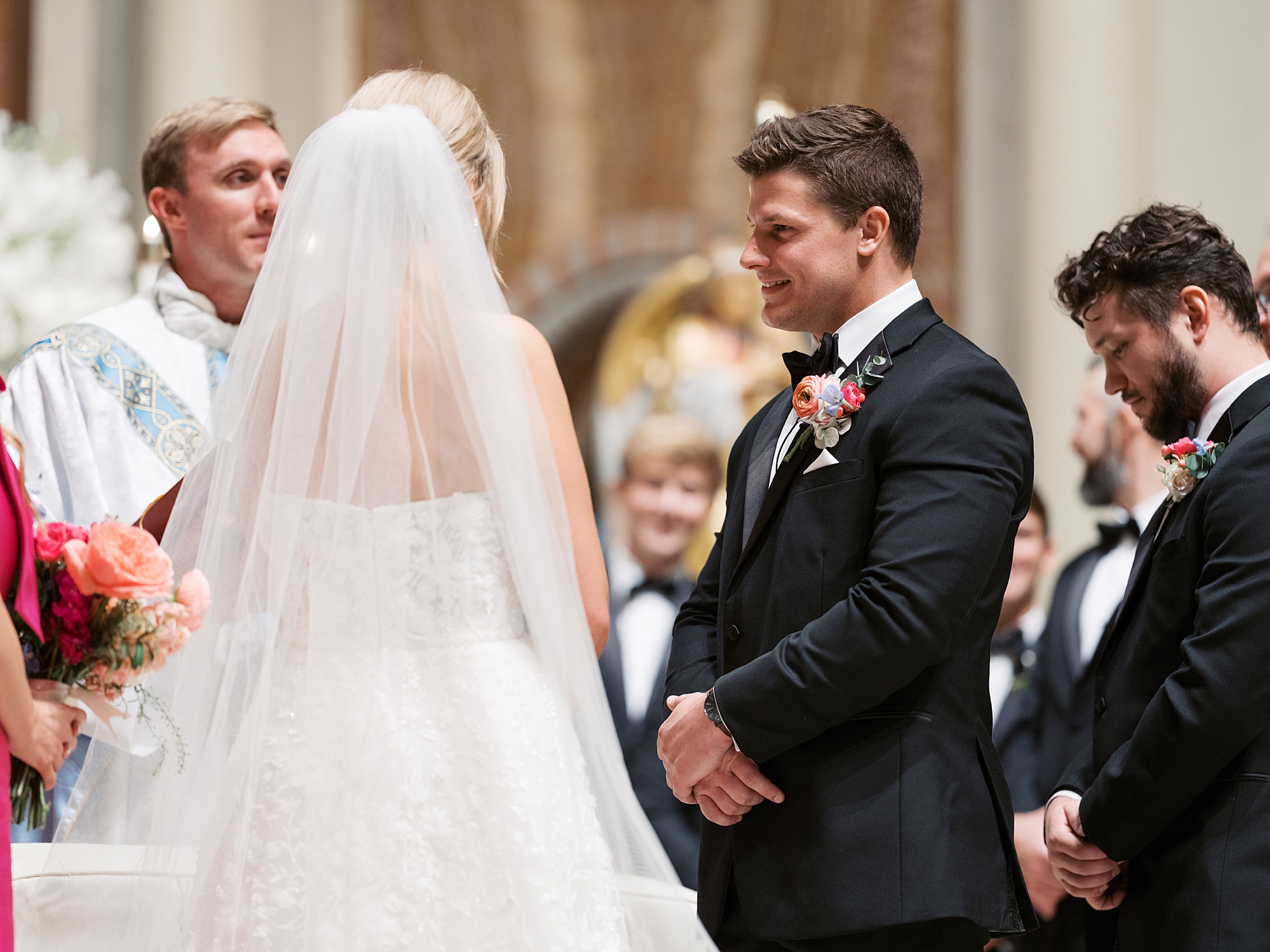 bride and groom exchange vows inside the Cathedral of St. John the Evangelist