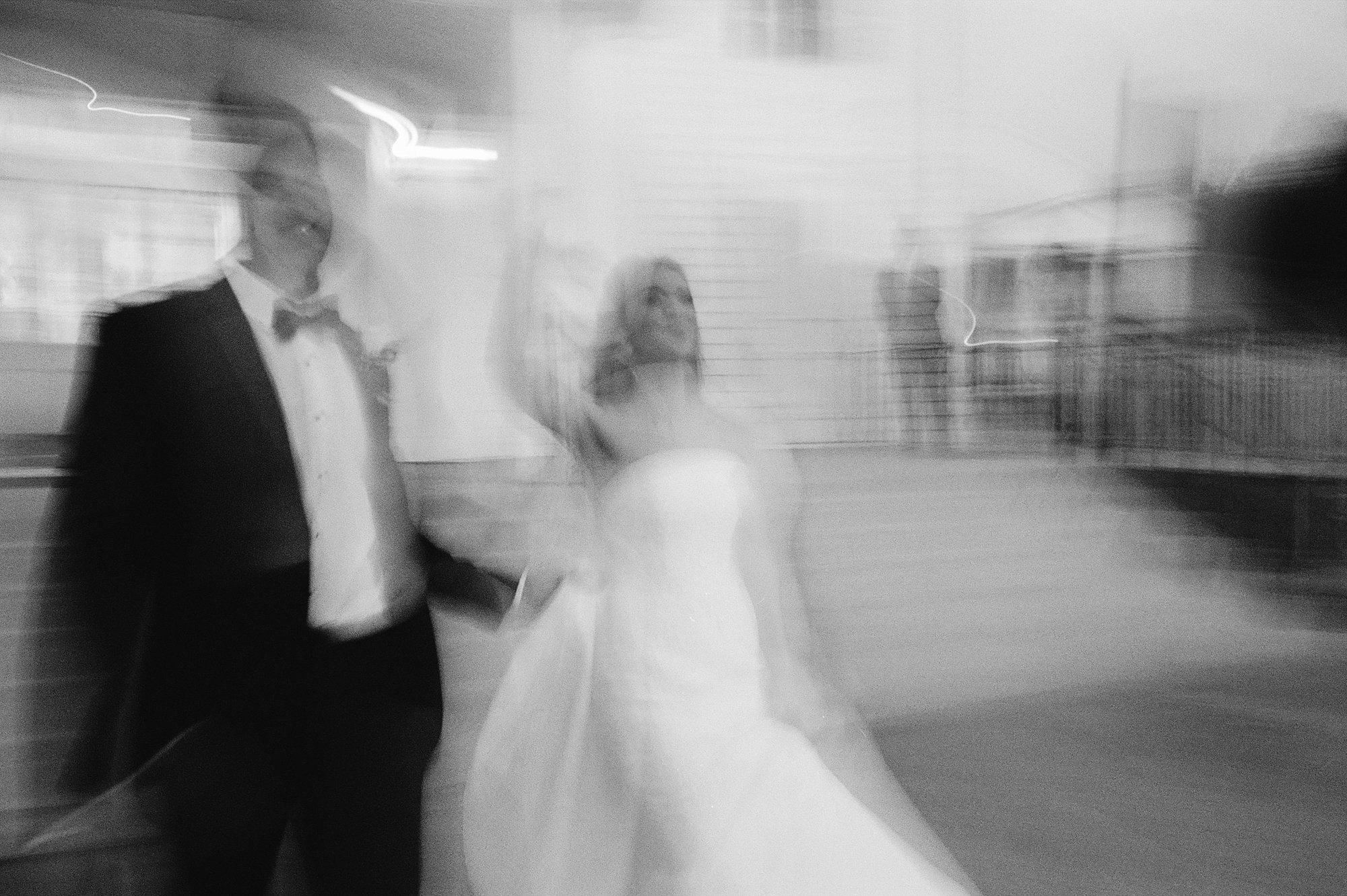 blurred photo of bride and groom on wedding day in Lafayette LA