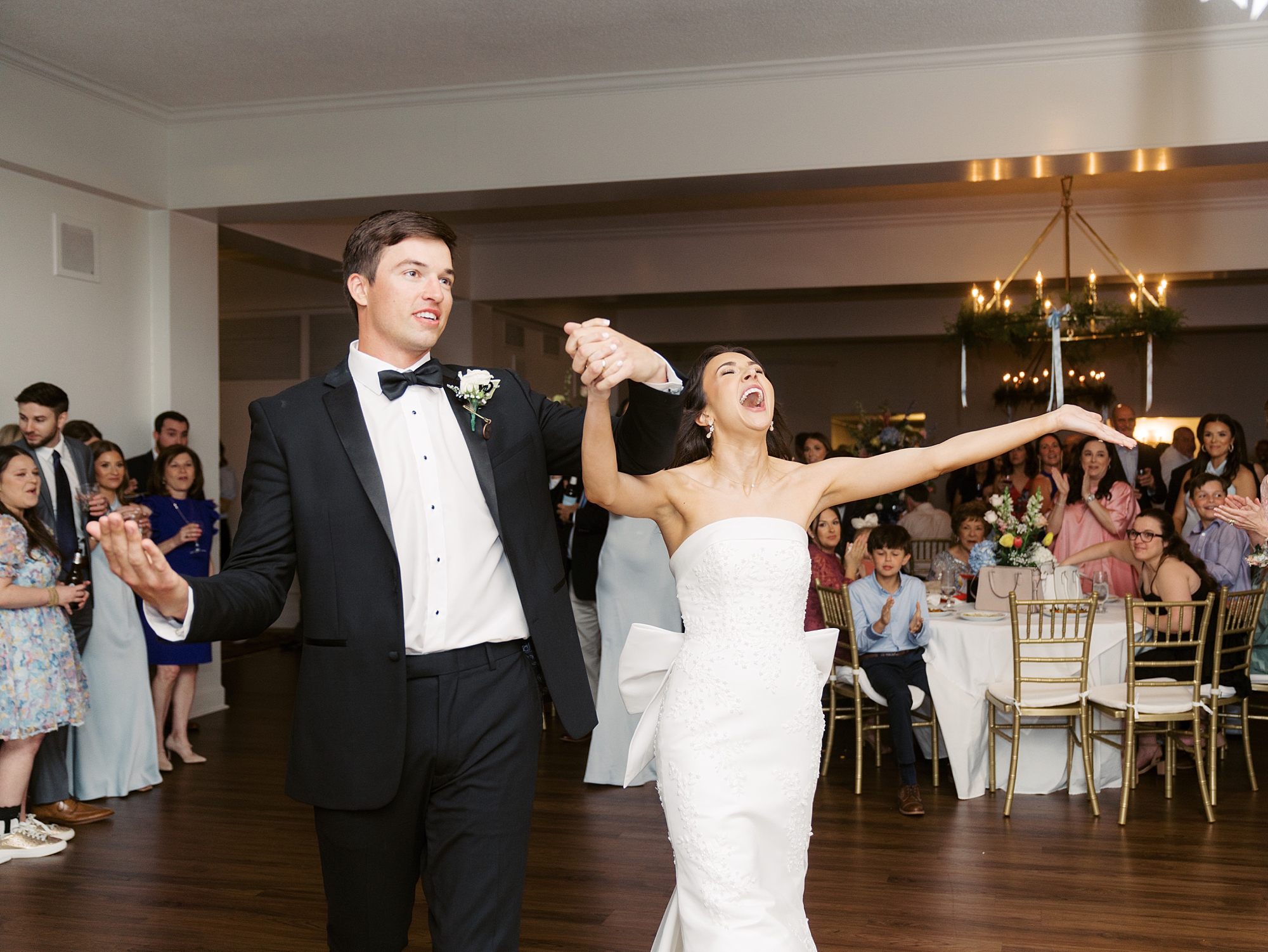 newlyweds cheer on dance floor at Oakbourne Country Club