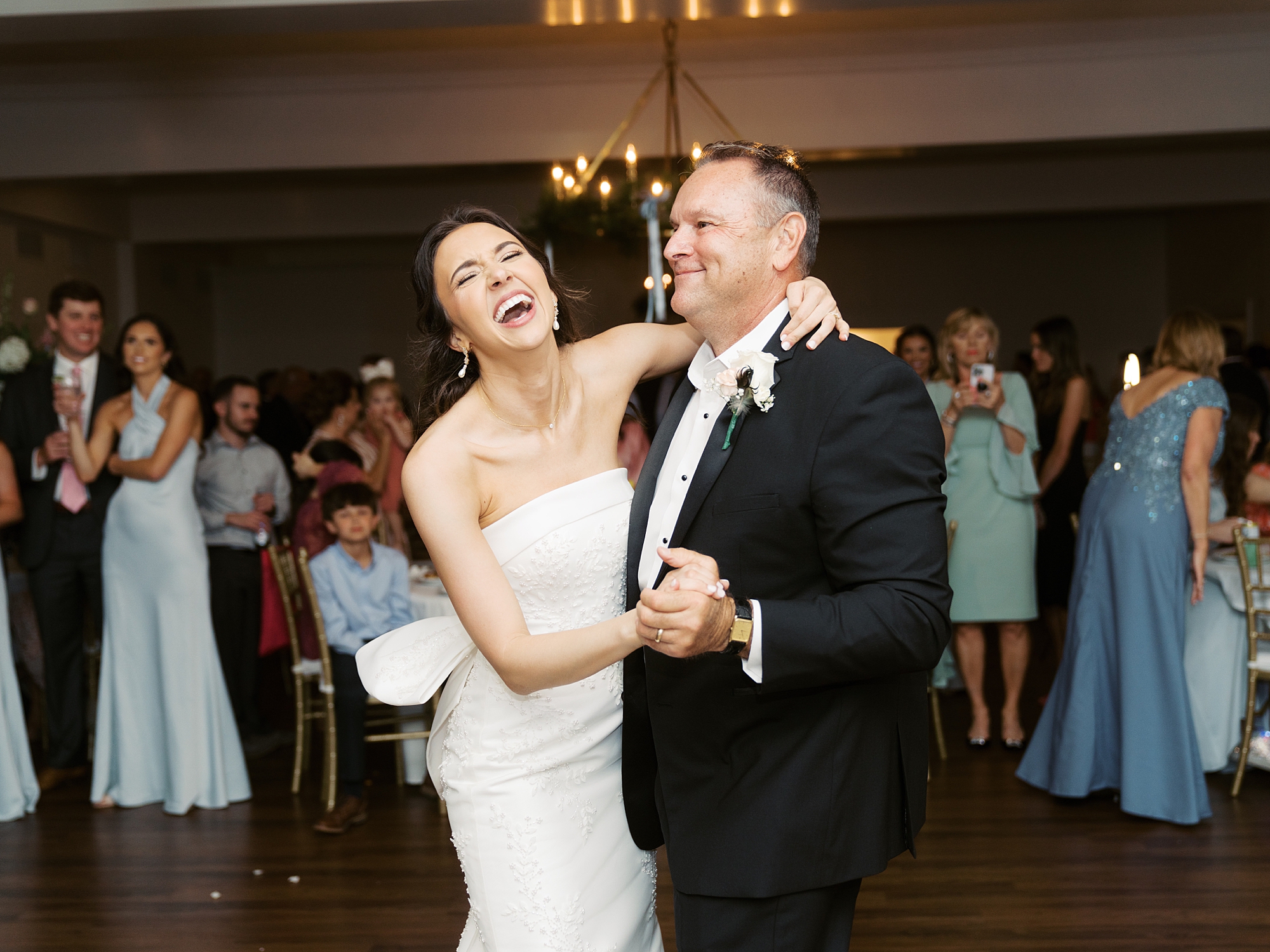 bride and groom dance during reception at Oakbourne Country Club
