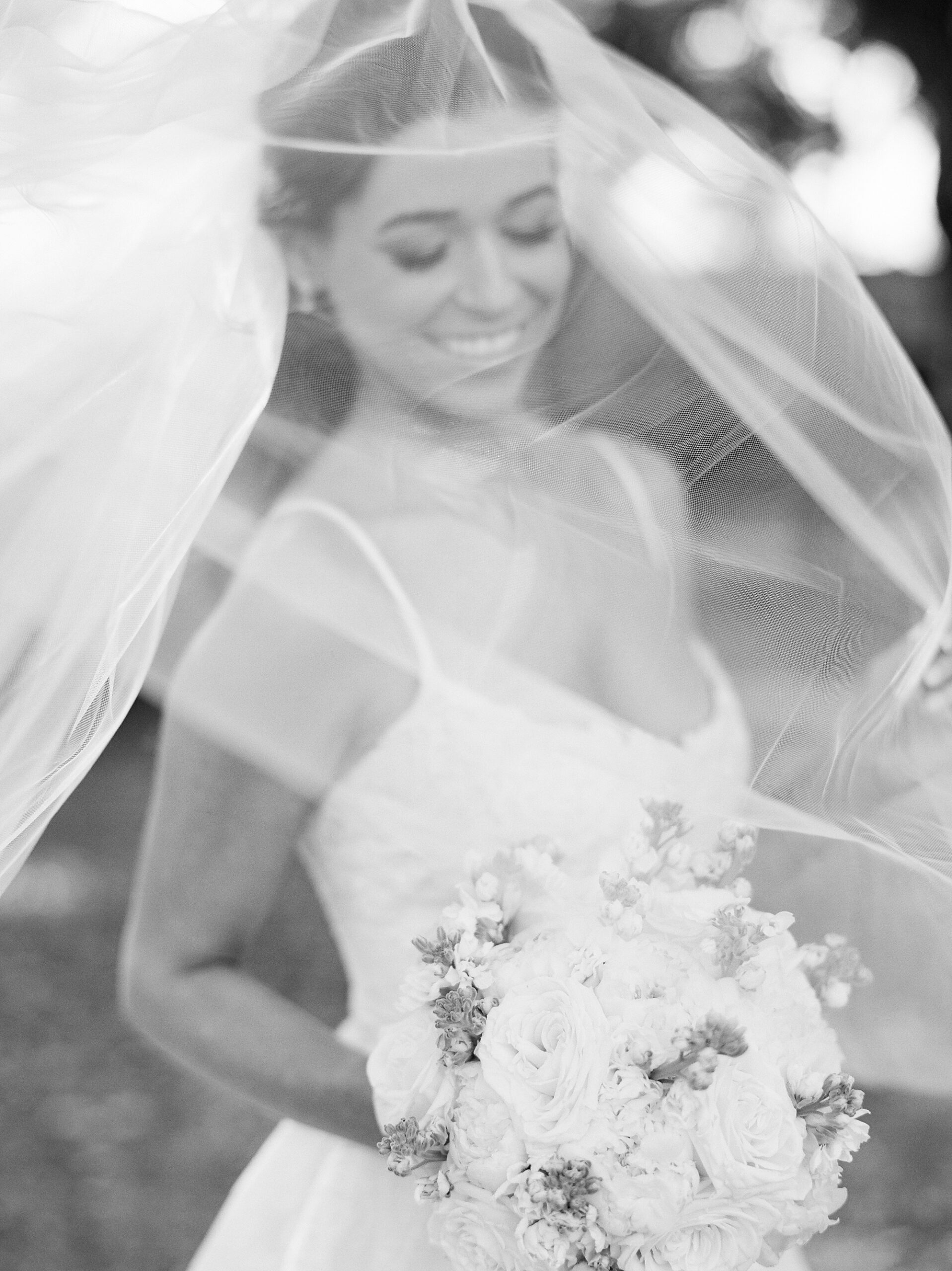 black and white portrait of bride under veil in Lafayette LA