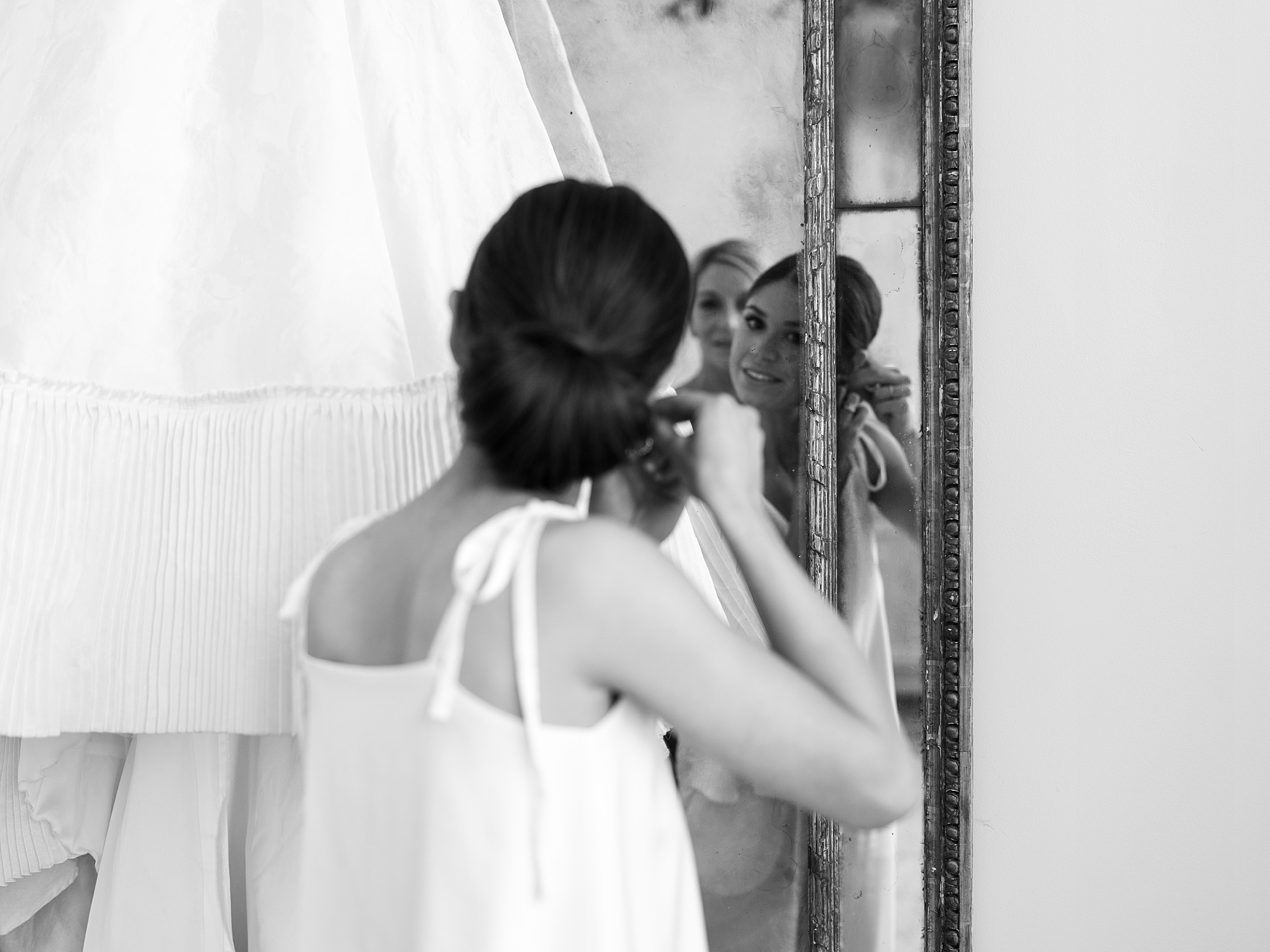 bride prepares for Lafayette LA wedding day in mirror