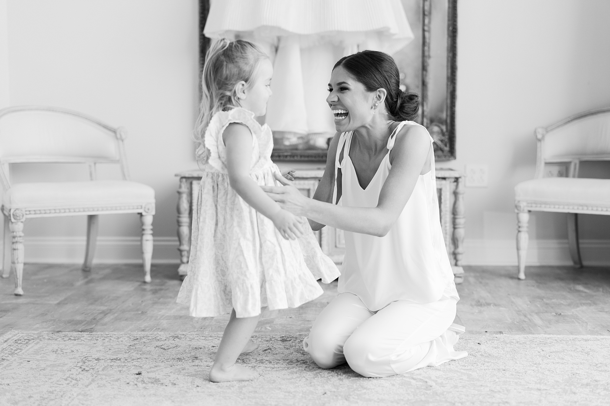 bride plays with flower girl on morning of Lafayette LA wedding 