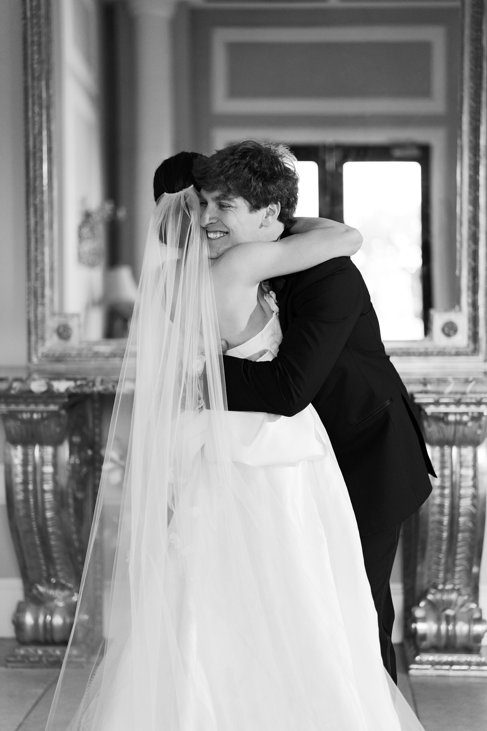 bride and groom hug during first look on the morning of Lafayette LA wedding day