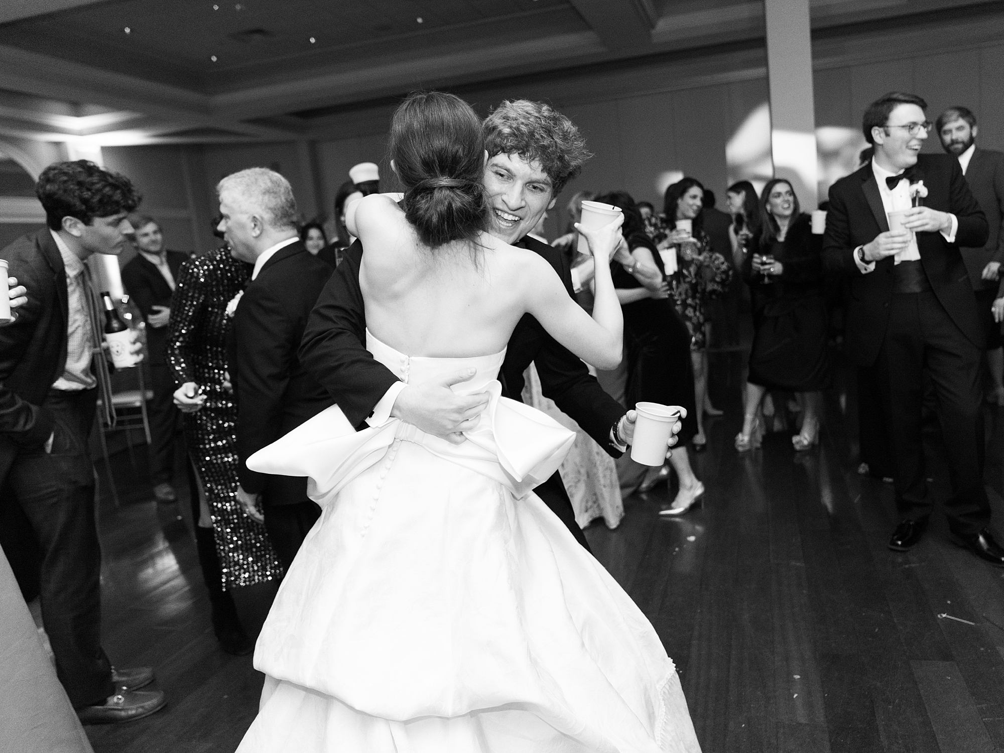 newlyweds dance with guests at Le Pavilion wedding reception in Lafayette LA